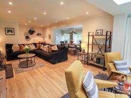 A living room with a sofa and coffee table at Underheron in Grasmere
