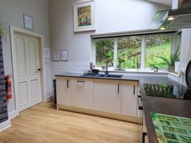 A kitchen featuring a sink, countertop, and window at Underheron in Grasmere