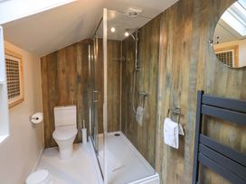 A bathroom with a shower and toilet at Underheron in Grasmere