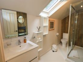 A bathroom with a shower and sink at Underheron in Grasmere