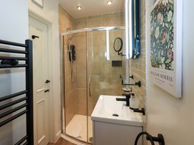 A bathroom with a shower and sink at Underheron in Grasmere