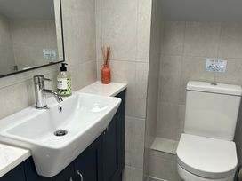 A bathroom with a sink and toilet at The Smithy in Keswick