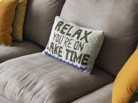 A sofa with decorative pillows at Take Five in Ambleside