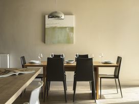 A dining room with a table and chairs at Take Five in Ambleside