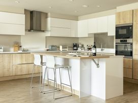 A kitchen with appliances on the counter at Take Five in Ambleside
