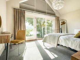 A bedroom with a bed and desk at Take Five in Ambleside