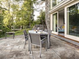 An outdoor dining area with a table and chairs at Take Five in Ambleside