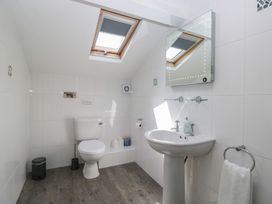 A bathroom with toilet and sink at Woodside West in Bowness