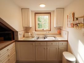 A kitchen with a sink and kettle at High Raise in Grasmere