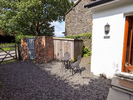 An outdoor area with a table and chairs at Abbots Reading Suite Lakeside