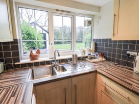 A kitchen with a sink and countertop at Smithy Cottage at Bowland Bridge Bowness