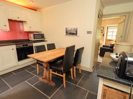 A kitchen with dining table and chairs at Beck Steps in Chapel Stile
