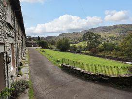 An outdoor area with stone houses and a pathway at Beck Steps in Chapel Stile