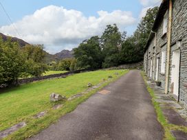 An outdoor view of a pathway and a stone building at Beck Steps in Chapel Stile