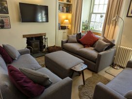 A living room with a sofa and television at Beck Steps in Chapel Stile