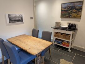 A dining room with a table and chairs at Beck Steps Chapel Stile