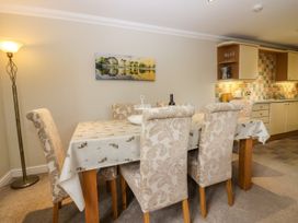 A dining room with a table and chairs at Middlerigg in Troutbeck