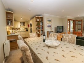 A dining room with a table and chairs at Middlerigg in Troutbeck