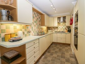 A kitchen with cabinets and a stove at Middlerigg in Troutbeck