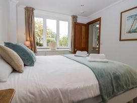 A bedroom with a bed and window at Middlerigg in Troutbeck