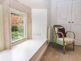 A corner with a chair and window at Middlerigg in Troutbeck