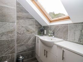 A bathroom with a sink and mirror at Middlerigg in Troutbeck