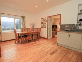 A dining room with a table and chairs at Fairfield Cottage in Grasmere