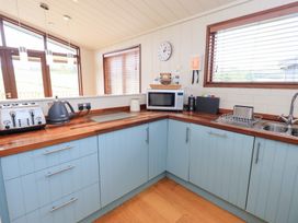 A kitchen with appliances and a sink at Thie Loghey in Hawkshead