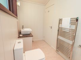 A bathroom with a toilet and sink at Thie Loghey in Hawkshead