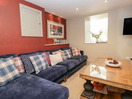 A living room with a sofa and a coffee table at Archie's in Ambleside