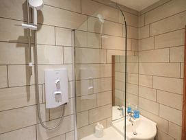 A bathroom with shower and sink at Boxwood Cottage in Troutbeck
