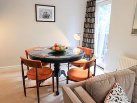 A dining room with a table and chairs at Ghyll Heights in Ambleside