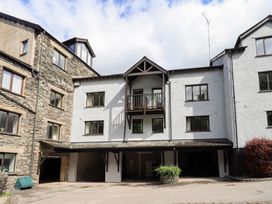 An exterior view of a building with a balcony at Ghyll Heights in Ambleside