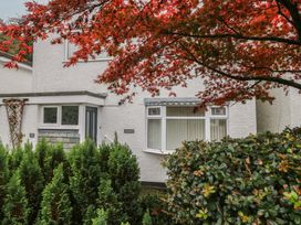 A house exterior with a window and foliage at Redwood in Ambleside