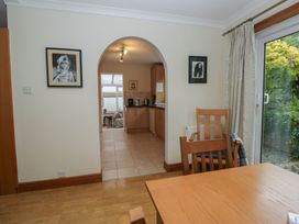 A dining room with a table and chairs at Redwood in Ambleside