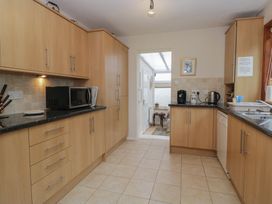 A kitchen with appliances and cabinets at Redwood in Ambleside