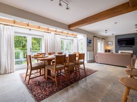 A dining room with a table and chairs at Goody Raise in Grasmere