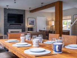 A dining room with a table set for a meal at Goody Raise in Grasmere