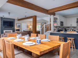 A dining room with a wooden table and chairs at Goody Raise in Grasmere