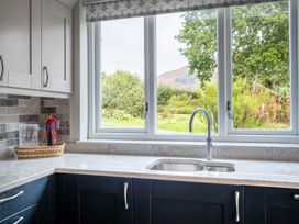 A kitchen with a sink and window at Goody Raise in Grasmere