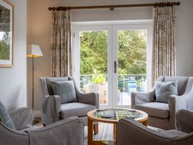 A living room with sofas and a table at Goody Raise in Grasmere