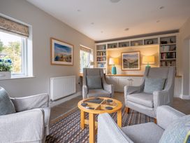 A snug with armchairs and coffee table at Goody Raise in Grasmere
