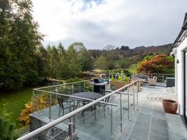 An outdoor space with a table and chairs at Goody Raise in Grasmere