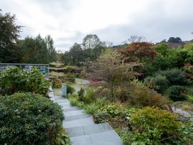 A garden with steps and various plants at Goody Raise in Grasmere