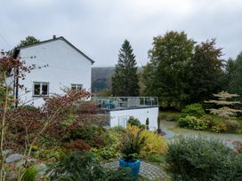A house with a garden and decking area at Goody Raise in Grasmere