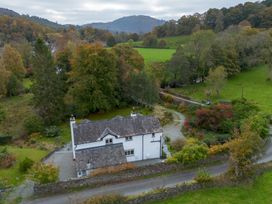 A house with a garden and driveway at Goody Raise in Grasmere