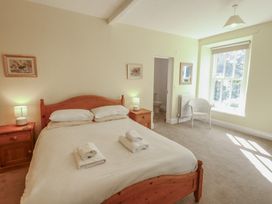 A bedroom with a bed and bedside tables at Hawkshead Hall in Hawkshead