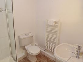 A bathroom with a toilet and sink at Hawkshead Hall in Hawkshead