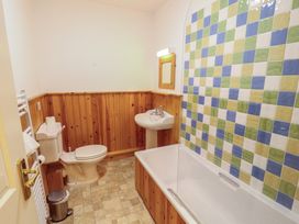 A bathroom with a sink and bathtub at Hawkshead Hall in Hawkshead