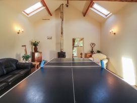 A recreation room with a ping pong table at Hawkshead Hall in Hawkshead